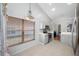 Bright kitchen with gray cabinets, stainless steel appliances, patterned floors, and a large window at 1610 Navigator Ln, Tarpon Springs, FL 34689