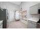 Well-lit kitchen with modern appliances, stylish flooring, and ample storage, ideal for culinary enthusiasts at 1610 Navigator Ln, Tarpon Springs, FL 34689