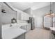 Modern kitchen featuring stainless steel appliances, white countertops, and ample cabinet space for storage at 1610 Navigator Ln, Tarpon Springs, FL 34689
