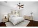 Bright main bedroom featuring a ceiling fan and two large windows at 1610 Navigator Ln, Tarpon Springs, FL 34689
