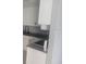 Close-up of a modern kitchen with white cabinets and granite countertops, showcasing the sink and faucet at 1615 Stevensons Dr, Clearwater, FL 33755