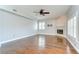 Spacious living room featuring a fireplace, hardwood floors, ceiling fan and plenty of natural light at 1632 Gray Bark Dr, Oldsmar, FL 34677