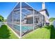 This backyard features a screened-in pool and patio area perfect for outdoor entertaining and relaxation at 1632 Gray Bark Dr, Oldsmar, FL 34677
