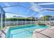 Clear blue swimming pool with a hot tub and manicured yard at 1632 Gray Bark Dr, Oldsmar, FL 34677