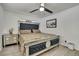 Comfortable bedroom featuring mirrored accents, plush bedding, and soft, neutral tones at 215 Deer Park Ave, Temple Terrace, FL 33617