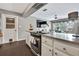 Open-concept kitchen with modern appliances, granite countertops, and ample cabinet space at 215 Deer Park Ave, Temple Terrace, FL 33617