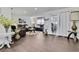 Elegant living room with sleek wood floors, recessed lighting, and an open layout that invites comfort at 215 Deer Park Ave, Temple Terrace, FL 33617