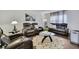 Cozy living room featuring modern leather furnishings and a stylish area rug on sleek wood floors at 215 Deer Park Ave, Temple Terrace, FL 33617