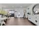 Elegant living room with sleek wood floors, recessed lighting, and an open layout that invites comfort at 215 Deer Park Ave, Temple Terrace, FL 33617