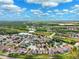 An aerial view shows a residential community with ponds and natural habitats near roadways at 2800 Flagler Ct, Trinity, FL 34655