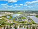 An aerial view shows a Primary-planned community with lakes, roadways, and attractive landscaping at 2800 Flagler Ct, Trinity, FL 34655