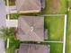 An aerial view shows a home with a well-maintained backyard and a white fence, surrounded by other homes at 2800 Flagler Ct, Trinity, FL 34655
