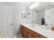 Bathroom features a large vanity with good storage and a bright neutral decor at 2800 Flagler Ct, Trinity, FL 34655