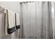 Bathroom featuring neutral wall color, decorative shower curtain and dark trim on towel at 2800 Flagler Ct, Trinity, FL 34655