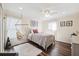 Comfortable bedroom features a bed swing, wood floors, and ample natural light at 2800 Flagler Ct, Trinity, FL 34655