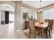 Elegant dining room with hardwood table, chandelier and access to living room at 2800 Flagler Ct, Trinity, FL 34655