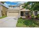 Charming two-story home with a well-maintained lawn and attached two car garage at 2800 Flagler Ct, Trinity, FL 34655