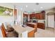 Spacious kitchen with stainless steel appliances, wood cabinets, and a center island at 2800 Flagler Ct, Trinity, FL 34655