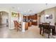 Bright, large kitchen featuring stainless steel appliances, wood cabinets and dining area at 2800 Flagler Ct, Trinity, FL 34655