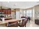 Open kitchen includes granite countertops, stainless steel appliances, and a dining area at 2800 Flagler Ct, Trinity, FL 34655