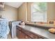 Functional laundry room with modern appliances, storage cabinets and counter space at 2800 Flagler Ct, Trinity, FL 34655
