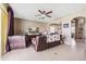 Inviting living room with tile flooring, ceiling fan and comfortable seating at 2800 Flagler Ct, Trinity, FL 34655