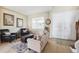 Cozy living room featuring tile floors, natural light and comfortable seating arrangements at 2800 Flagler Ct, Trinity, FL 34655