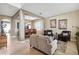 Bright living room open to the dining room featuring neutral colors, tile floors, and lots of light at 2800 Flagler Ct, Trinity, FL 34655