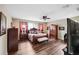 Primary bedroom with hardwood flooring, ceiling fan, and abundant natural light at 2800 Flagler Ct, Trinity, FL 34655