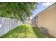 Backyard features lush green grass and a private screened-in porch at 2927 Hickory Grove Dr, Valrico, FL 33596
