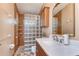 Bathroom features a stylish vanity with a modern sink and glass block shower at 2927 Hickory Grove Dr, Valrico, FL 33596
