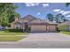Charming single-story home featuring a three-car garage, well-maintained lawn, and welcoming curb appeal at 2927 Hickory Grove Dr, Valrico, FL 33596