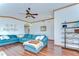 Spacious living room featuring wood floors, decorative trim, and a comfortable sectional sofa at 2927 Hickory Grove Dr, Valrico, FL 33596