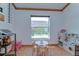 Play Room featuring natural light, decorative trim and tiled floors at 2927 Hickory Grove Dr, Valrico, FL 33596