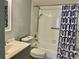 The bathroom features a shower and tub combination with a shower curtain at 3025 Bonaventure Cir # 103, Palm Harbor, FL 34684