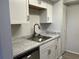 Bright kitchen featuring stainless steel appliances and ample counter space at 3025 Bonaventure Cir # 103, Palm Harbor, FL 34684
