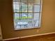 The window looks out onto an outdoor seating area at 3025 Bonaventure Cir # 103, Palm Harbor, FL 34684