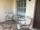 Cozy outdoor patio area perfect for enjoying morning coffee or evening relaxation at 3025 Bonaventure Cir # 103, Palm Harbor, FL 34684