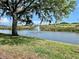 Scenic pond with a fountain, adding a touch of tranquility and natural beauty to the surroundings at 3025 Bonaventure Cir # 103, Palm Harbor, FL 34684