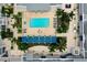 Overhead view of the pool and amenities, including lounge chairs and meticulously landscaped greenery at 331 Cleveland St # 320, Clearwater, FL 33755
