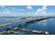 Scenic aerial of the waterfront and bridge, with sailboats and a clear sky adding to the picturesque landscape at 331 Cleveland St # 320, Clearwater, FL 33755