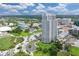 Beautiful aerial view of a high-rise building in a park with lush green space and a community area at 331 Cleveland St # 320, Clearwater, FL 33755