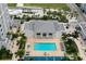 Aerial perspective of the community pool area, with lounging chairs and landscaped surroundings at 331 Cleveland St # 320, Clearwater, FL 33755