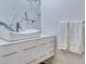 Elegant bathroom featuring a vessel sink, white vanity, and luxurious marble accent wall at 331 Cleveland St # 320, Clearwater, FL 33755