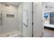 Walk-in shower with tile surround and glass enclosure at 331 Cleveland St # 320, Clearwater, FL 33755