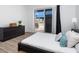 Bedroom featuring a slider to the patio and a dark wood dresser at 331 Cleveland St # 320, Clearwater, FL 33755