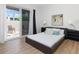 Bedroom with access to the outdoor patio and natural lighting at 331 Cleveland St # 320, Clearwater, FL 33755
