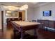 Spacious game room featuring a pool table, bar area, and modern finishes perfect for entertaining guests at 331 Cleveland St # 320, Clearwater, FL 33755