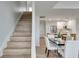 Bright open floor plan features a staircase adjacent to the dining and kitchen areas at 331 Cleveland St # 320, Clearwater, FL 33755
