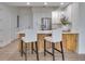 Bright and airy kitchen featuring an island with seating and stainless steel appliances at 331 Cleveland St # 320, Clearwater, FL 33755